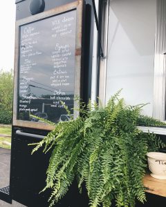 food and coffee truck chalkboard menu with plant